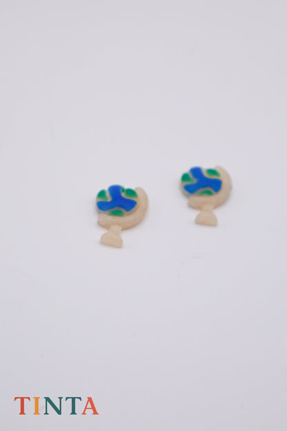 Pair of earrings with blue and green design on a white background, featuring the brand 'TINTA'.