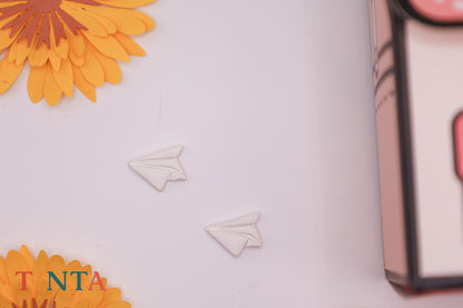 Decorative elements with flowers and paper airplanes on a light background